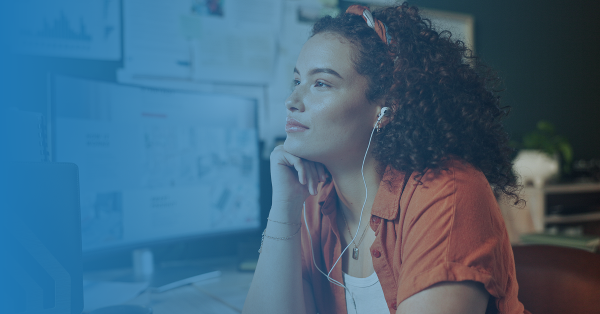 person thinking as they listen to headphones